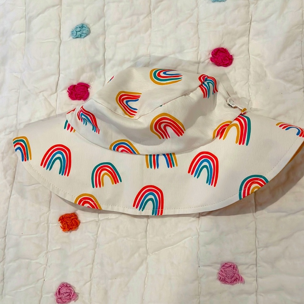 MudPie White and Rainbows print beach hat. Never worn. Velcro straps. New.